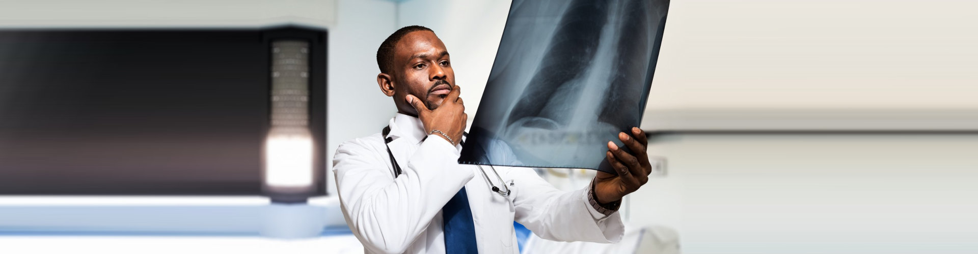 portrait of a doctor looking at a radiography